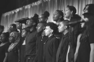 Students singing on risers at a gala