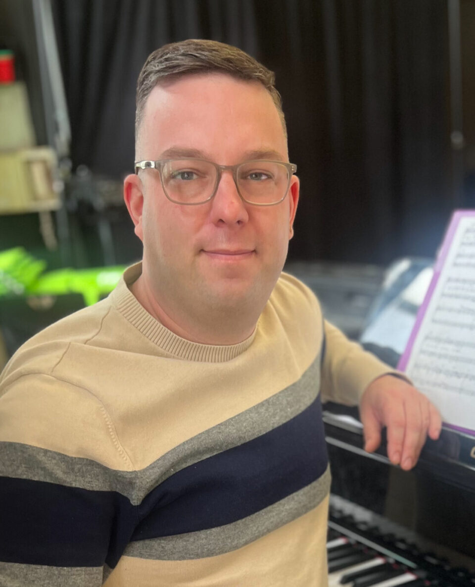 Tom Carroll, man sitting at piano