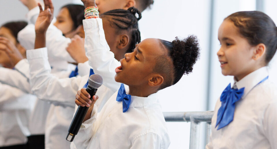 boy in a choir singing